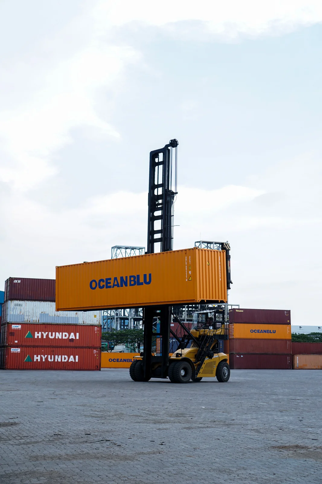 Container-handling equipment at a freight terminal — supporting logistics photograph