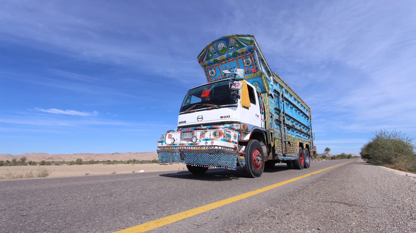 Decorated freight truck on a road in Pakistan supporting regional cargo transportation