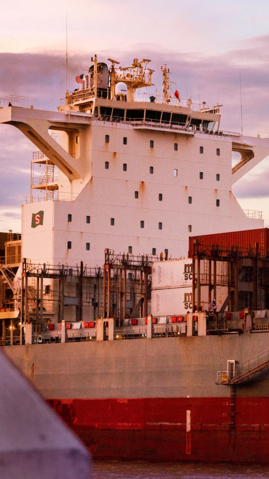 Commercial cargo vessel and freight containers at a port
