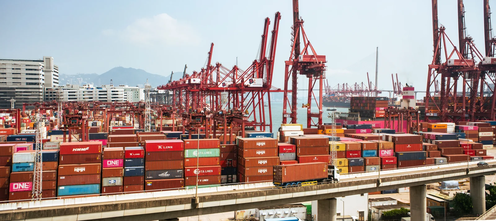 Cargo containers and cranes at a commercial port