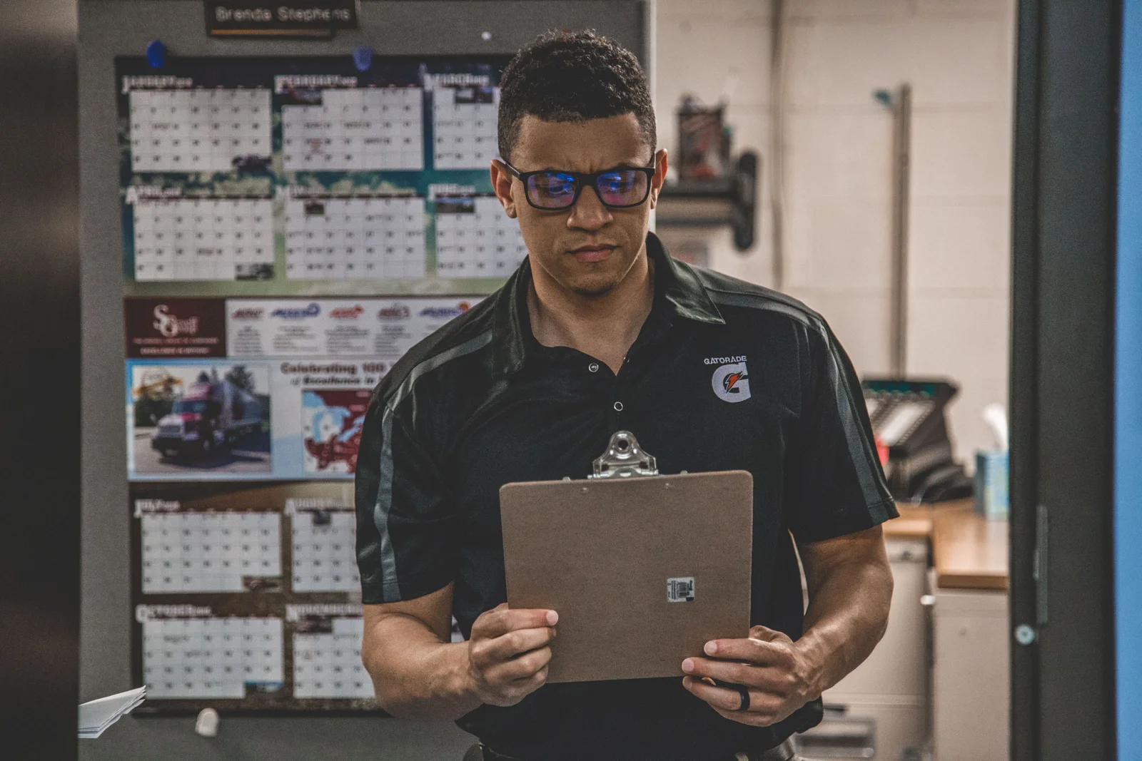 Warehouse professional checking cargo documentation on a clipboard