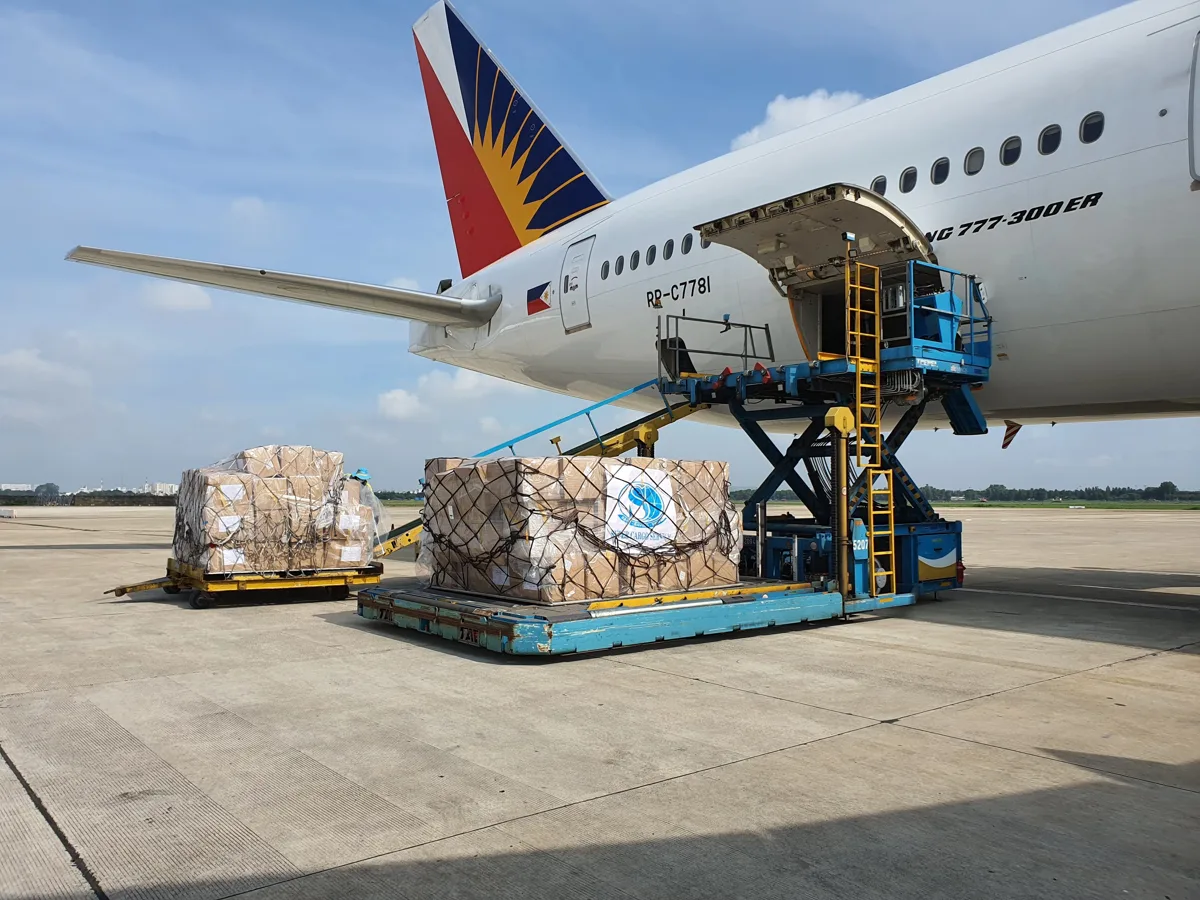 Cargo boxes being loaded onto an aircraft