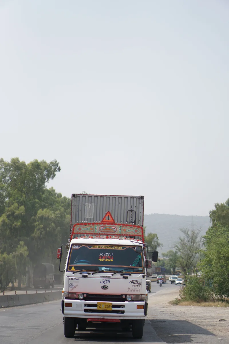 Decorated freight truck on a highway in Pakistan