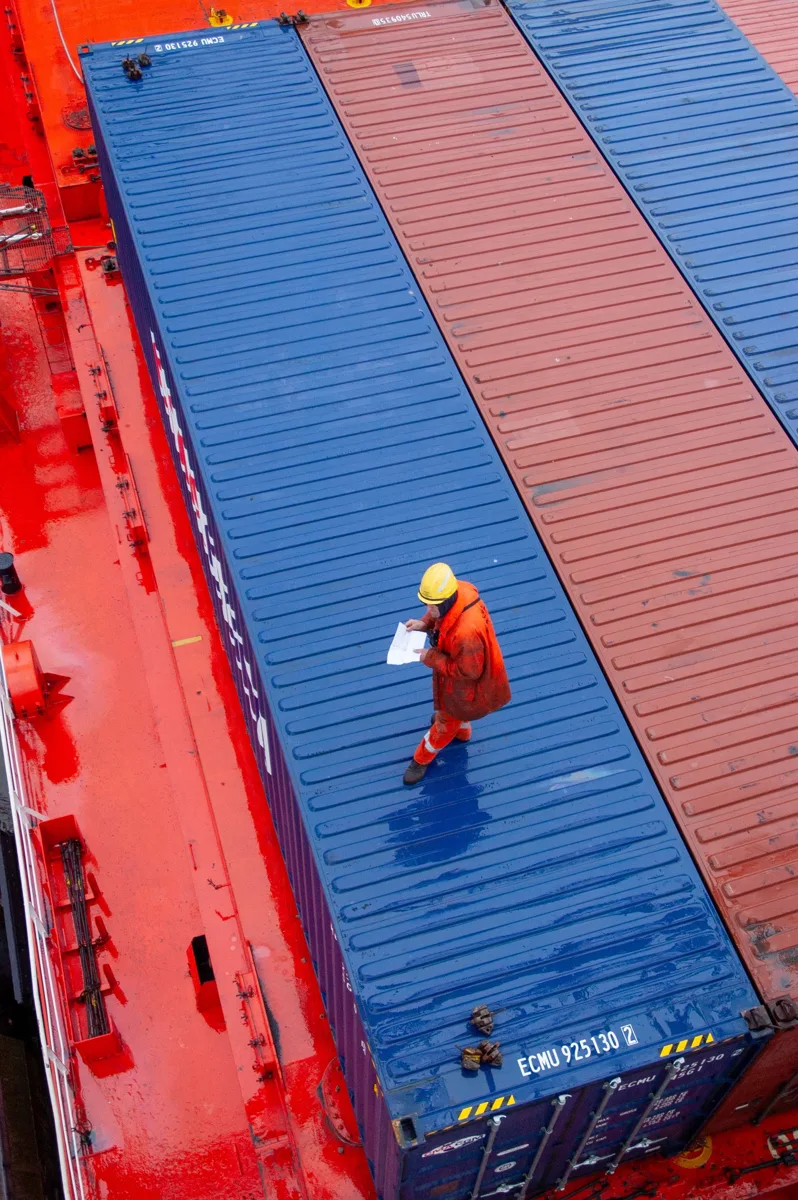 Logistics worker checking cargo loading documents