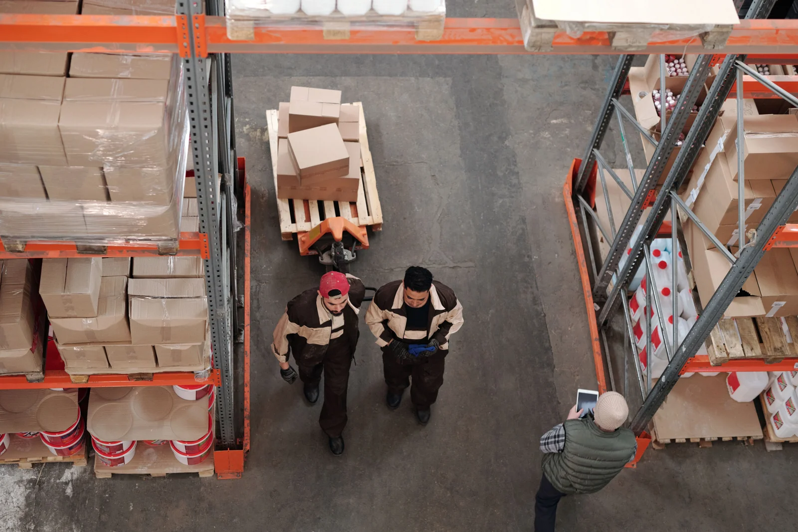 Warehouse team organizing boxes and pallets for storage and shipment