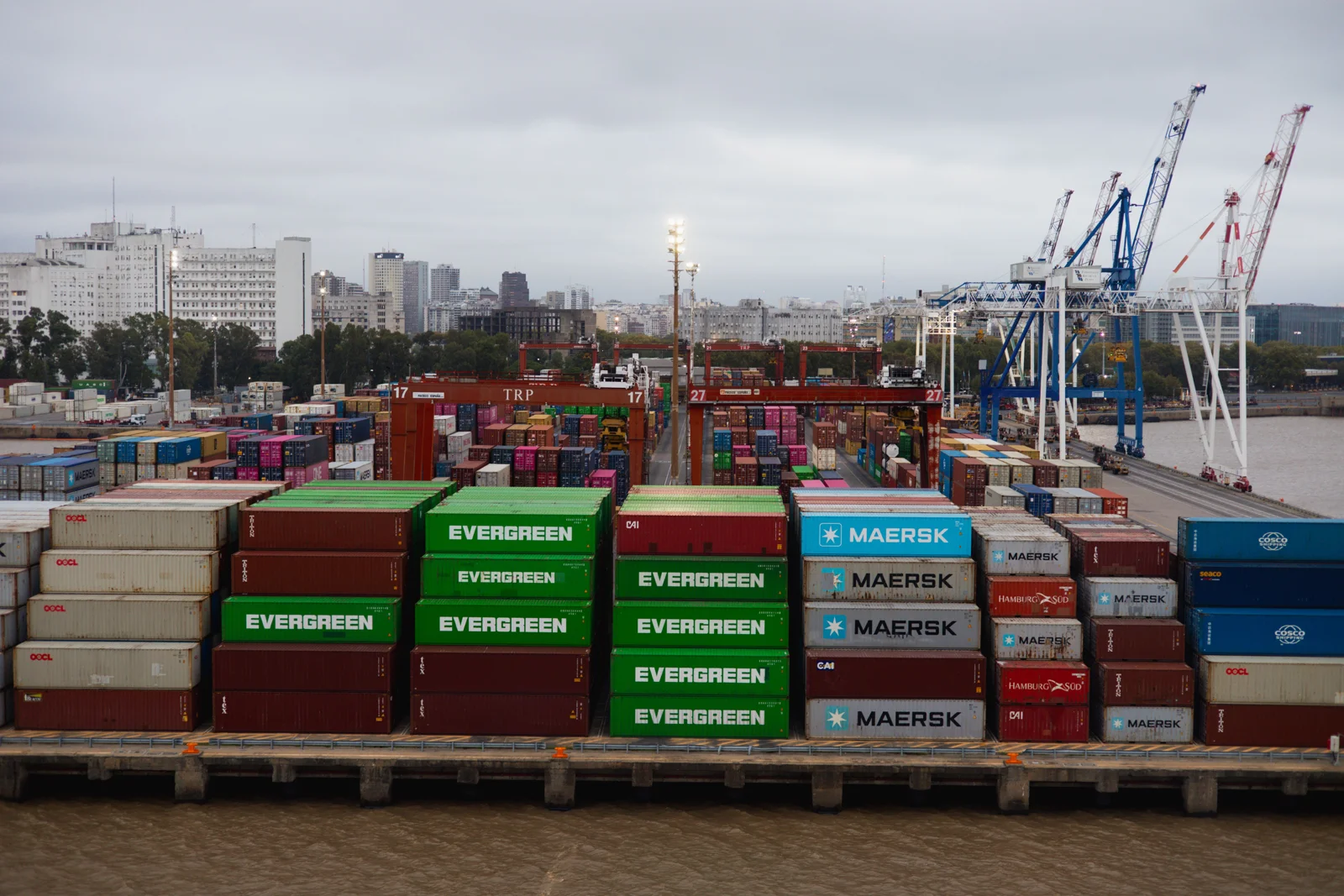 International shipping port with cargo containers and cranes