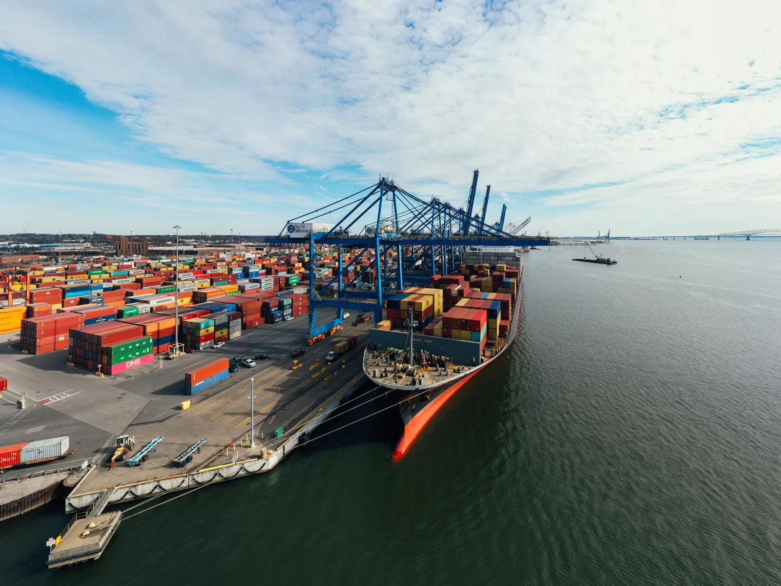 Cargo vessel and containers at a commercial seaport